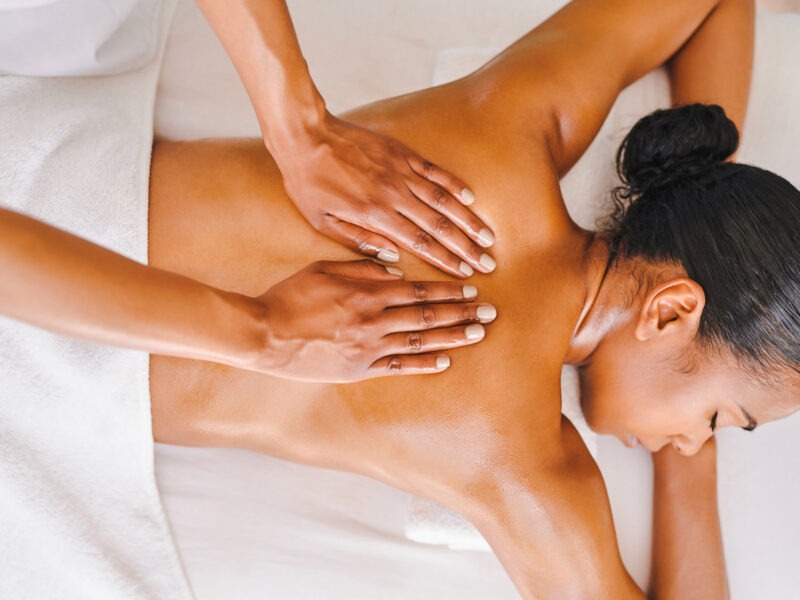 Shot of an attractive young woman getting a massage at a spa